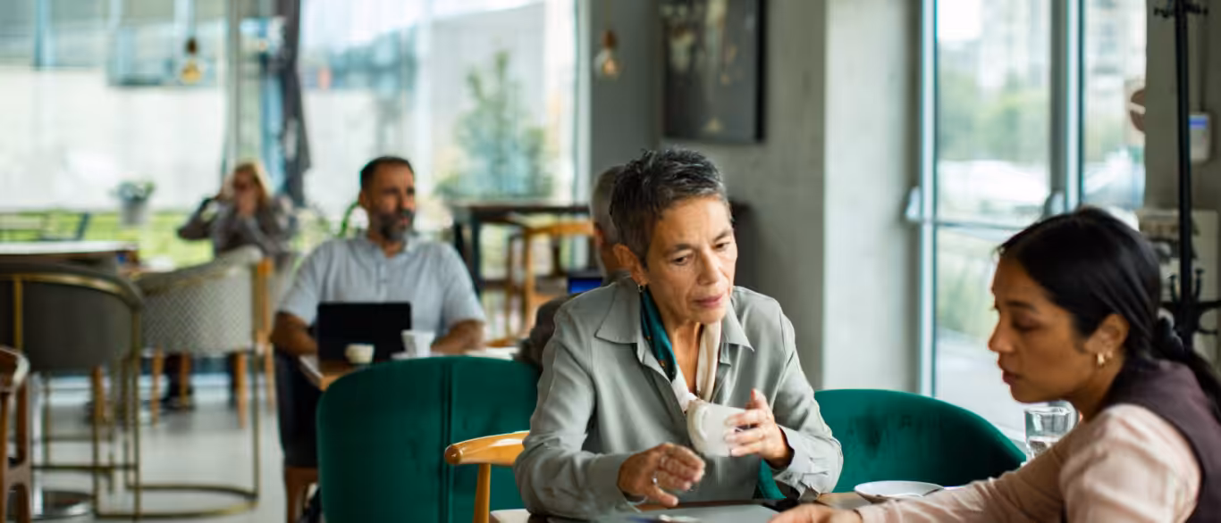 Self-employed borrower reviewing lo doc home loan documents with a mortgage broker